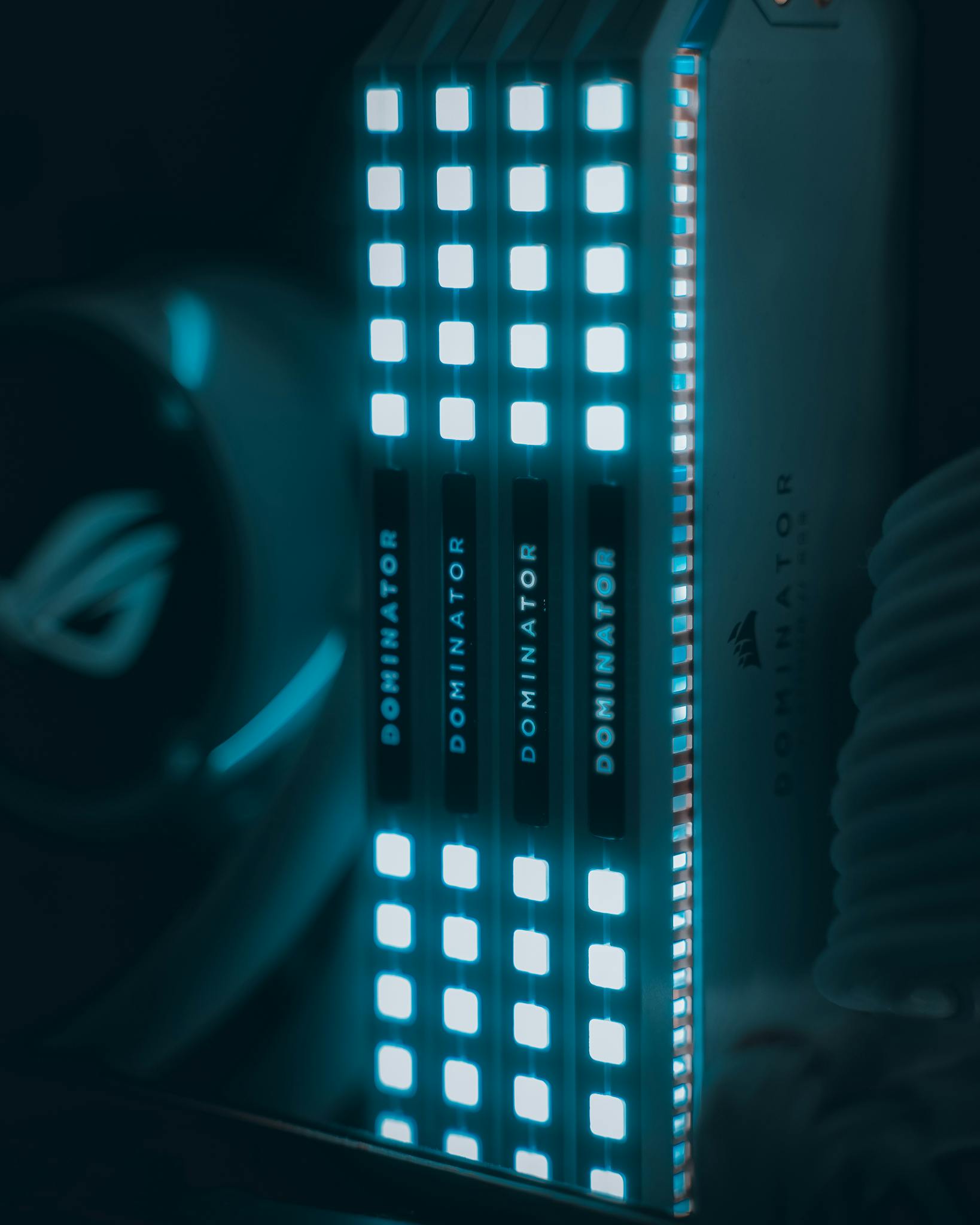 Close-up view of glowing computer RAM modules with blue illumination, highlighting technology.